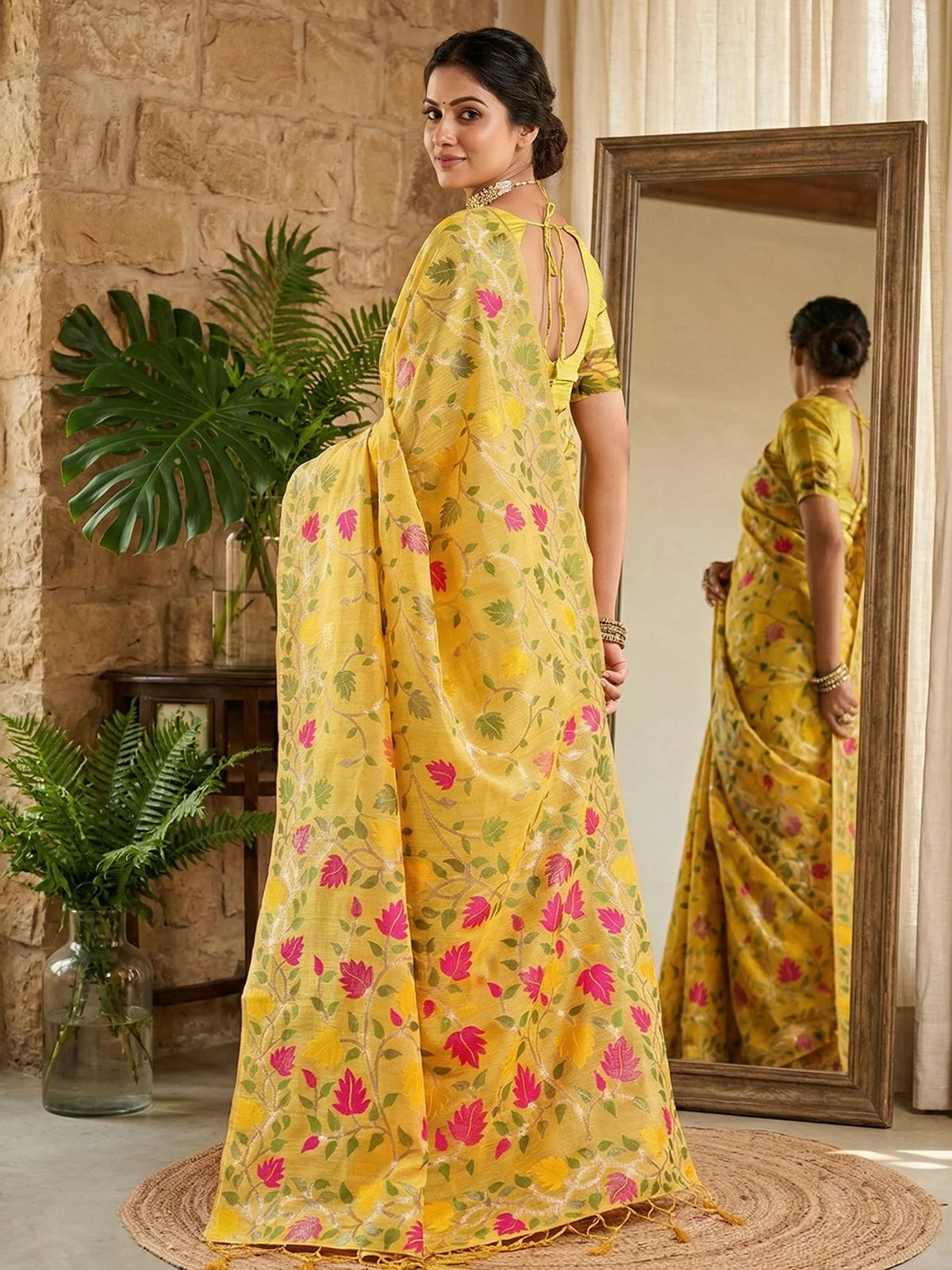 Tarani yellow linen cotton saree back view showing elegant drape and floral weaving Sadhana