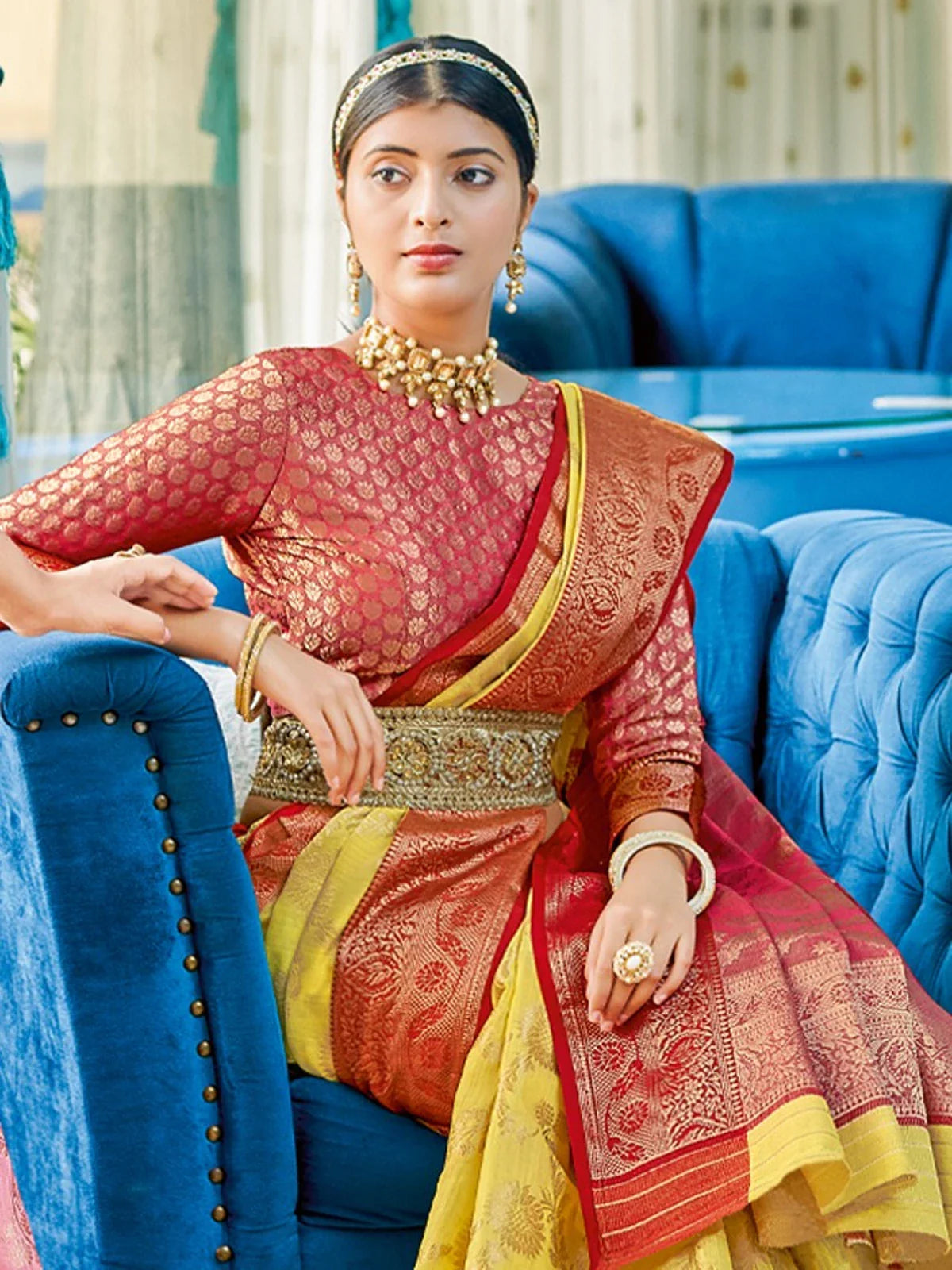 Tarani festive yellow linen cotton saree close-up showing elegant red blouse and woven design