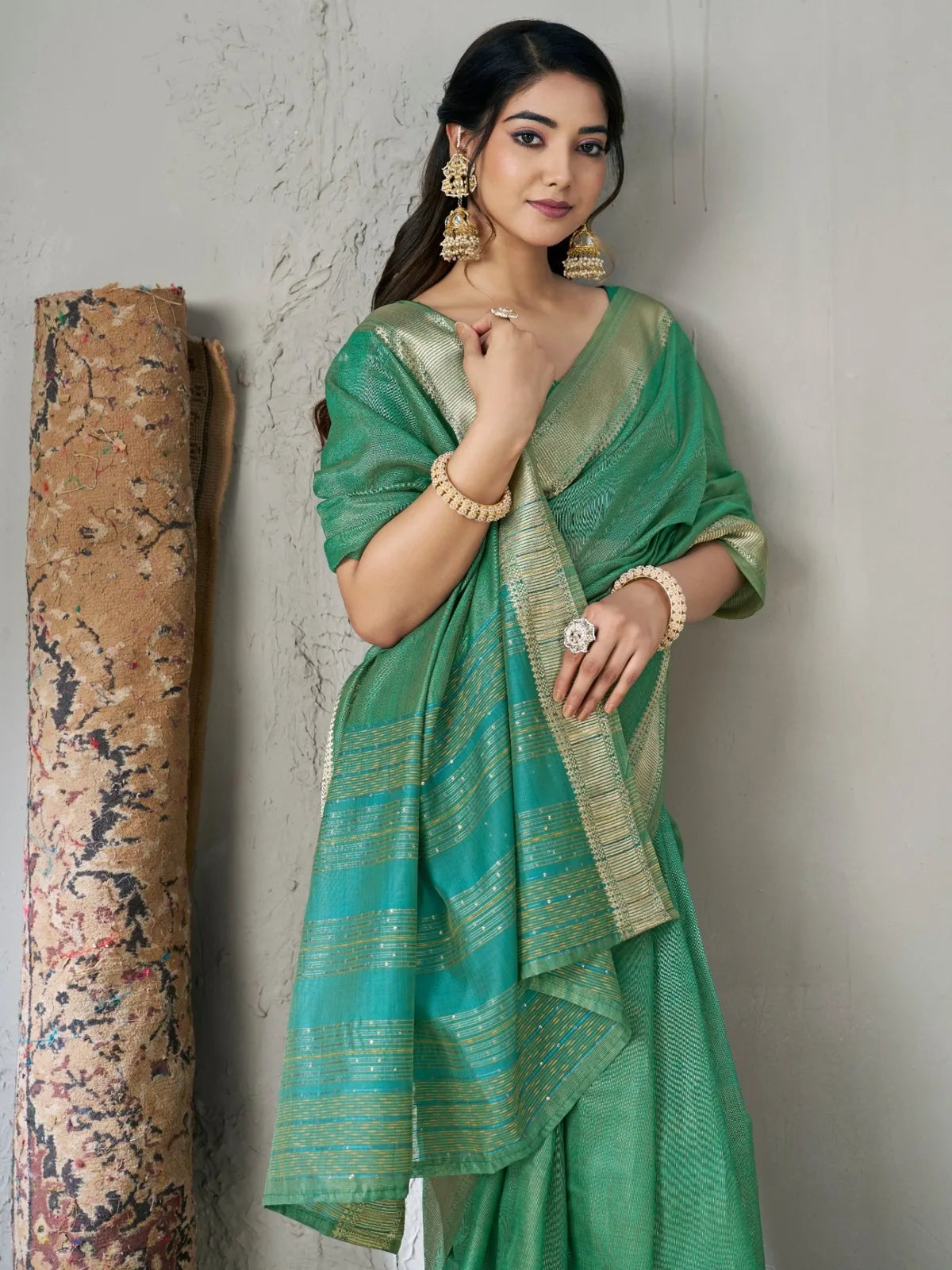 Tarani green linen cotton silk saree pallu view with zari border and festive styling