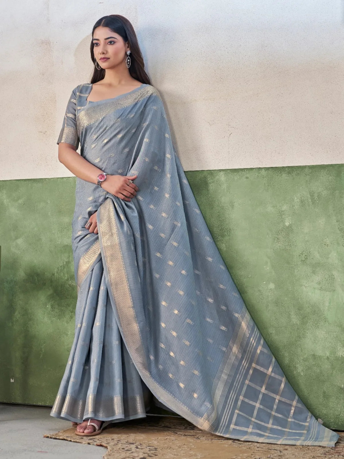 Tarani grey blue party wear saree with woven pallu and elegant side pose