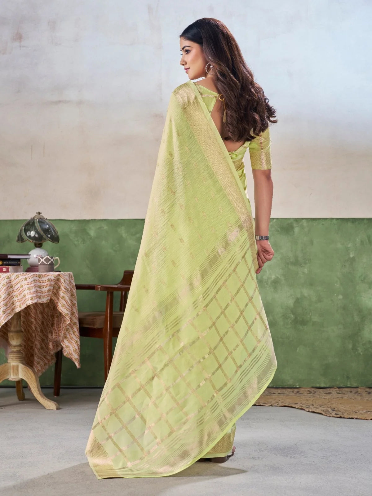 Tarani Navya back view showcasing pallu drape and blouse style