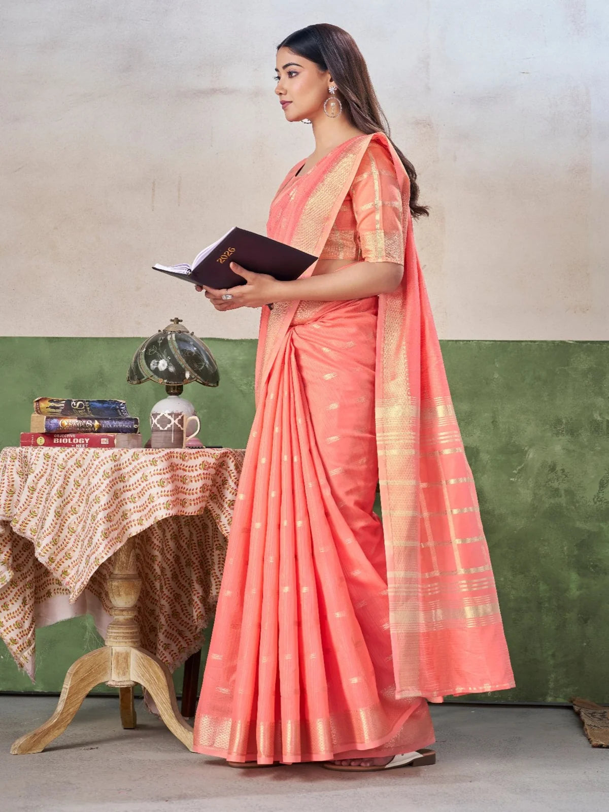 Tarani peach party wear saree side profile showcasing drape and pallu