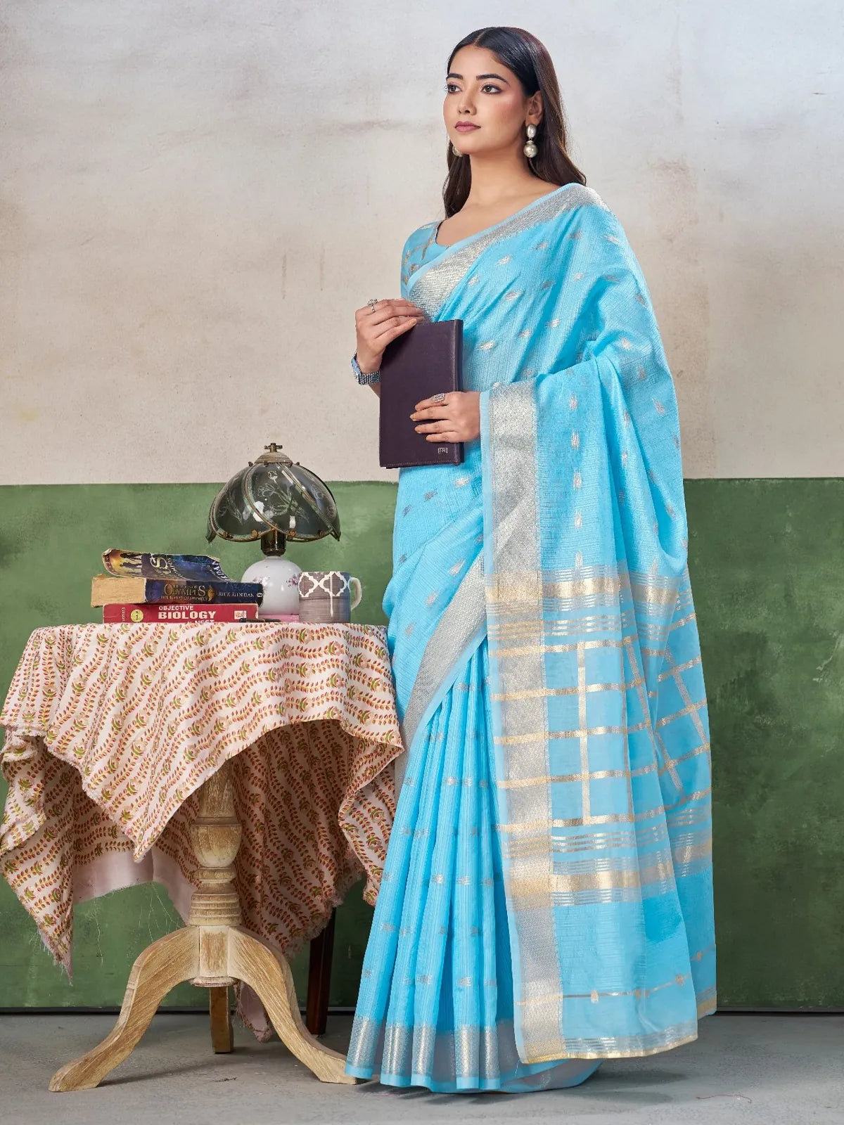 Tarani sky blue linen cotton silk saree side pose with elegant zari border