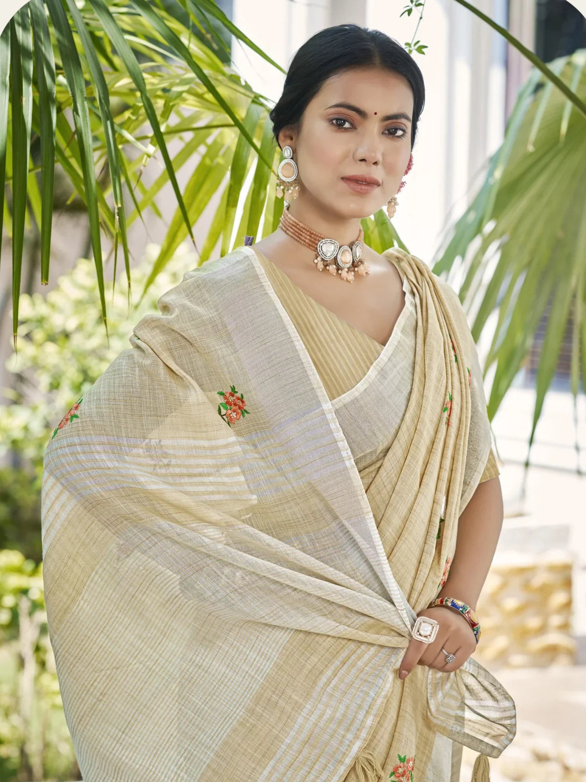 Tarani beige linen saree close up showing upper body with embroidery and blouse