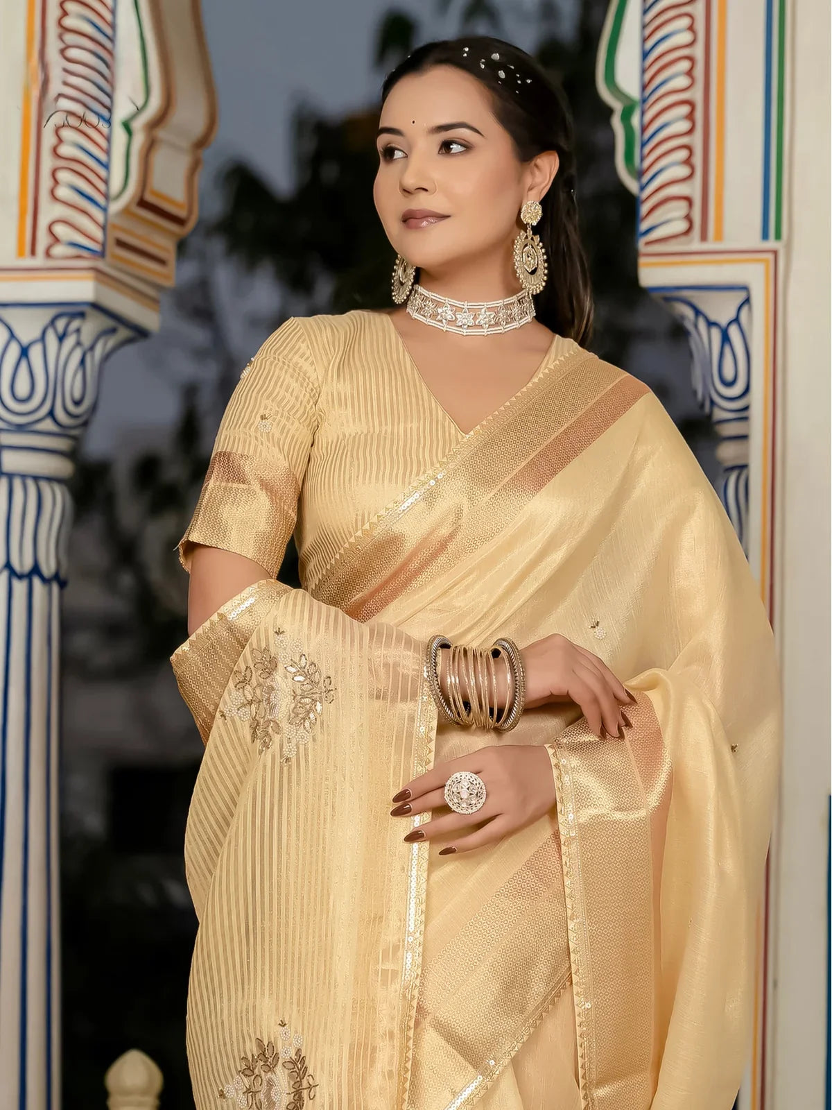 Tarani beige saree upper body view with zari border and khatli butti work blouse