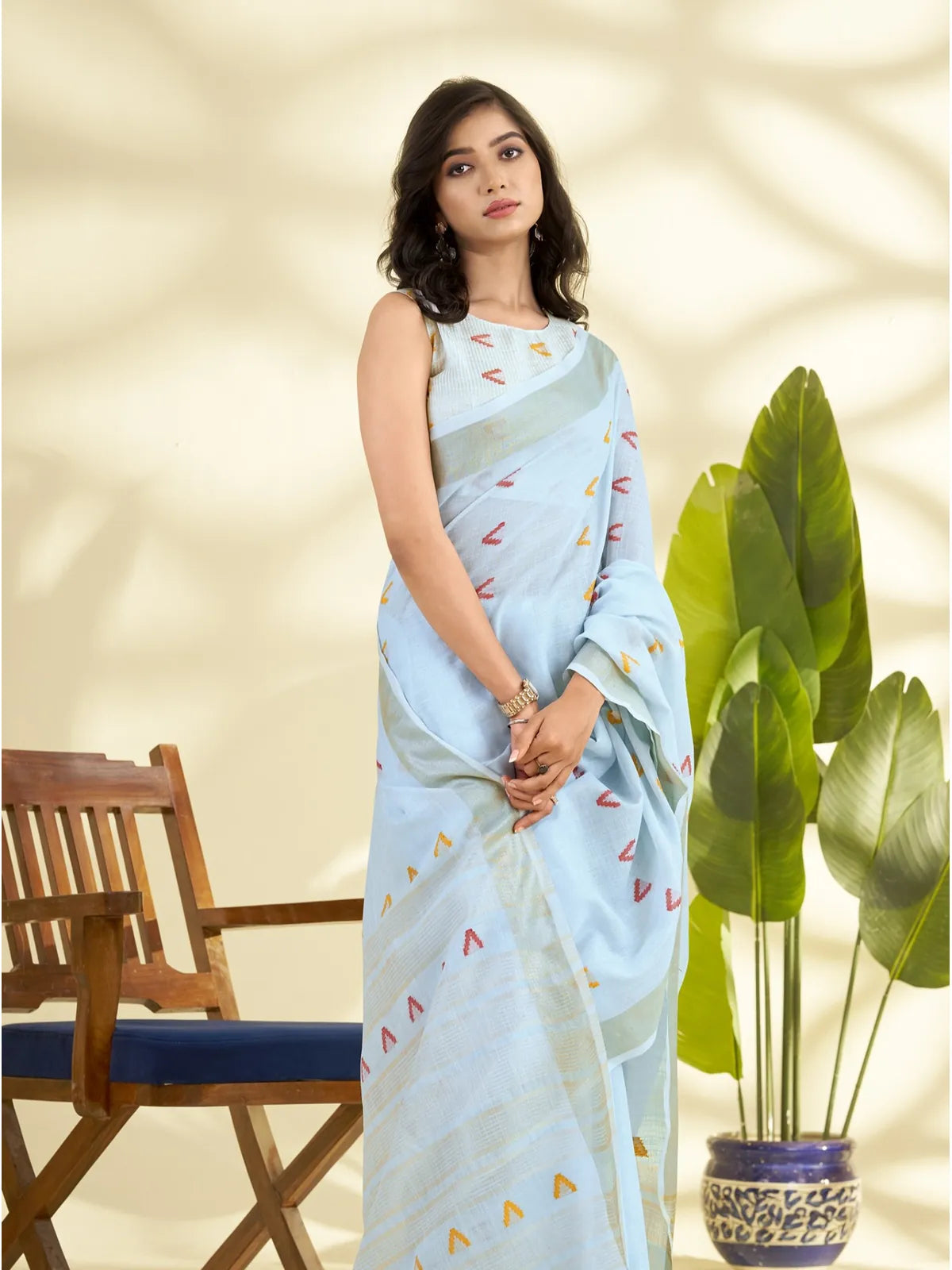 Tarani front view of blue linen saree with zari pallu and multicolor detailing for office and casual wear