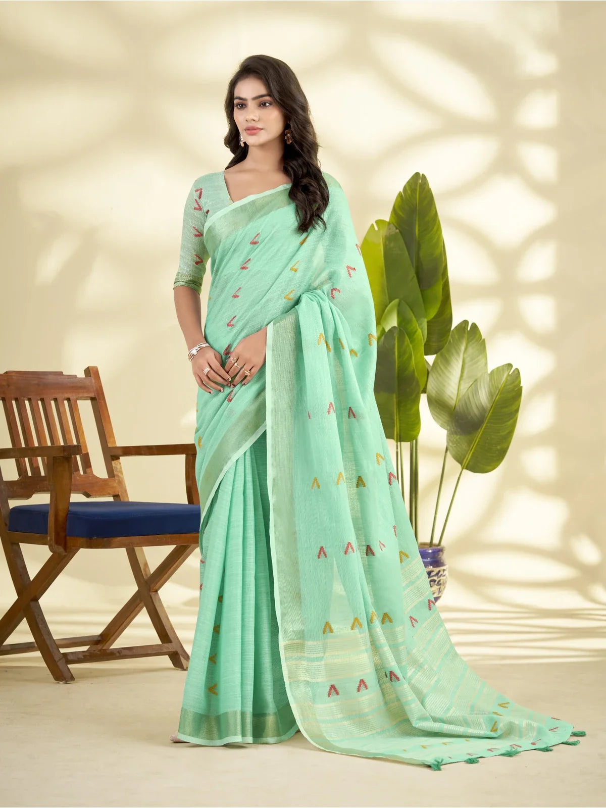 Tarani green linen silk saree with zari border and multicolor woven motifs full view
