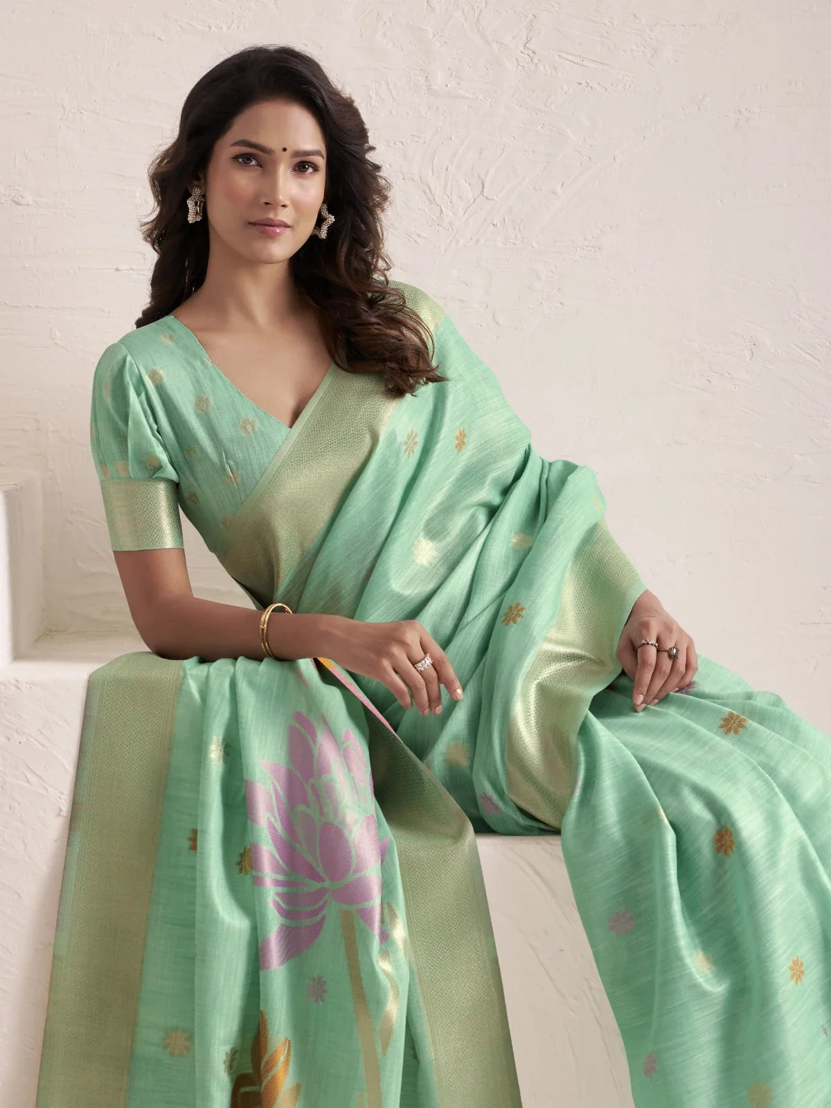 Tarani green linen saree upper body view showing elegant jacquard blouse and smooth drape