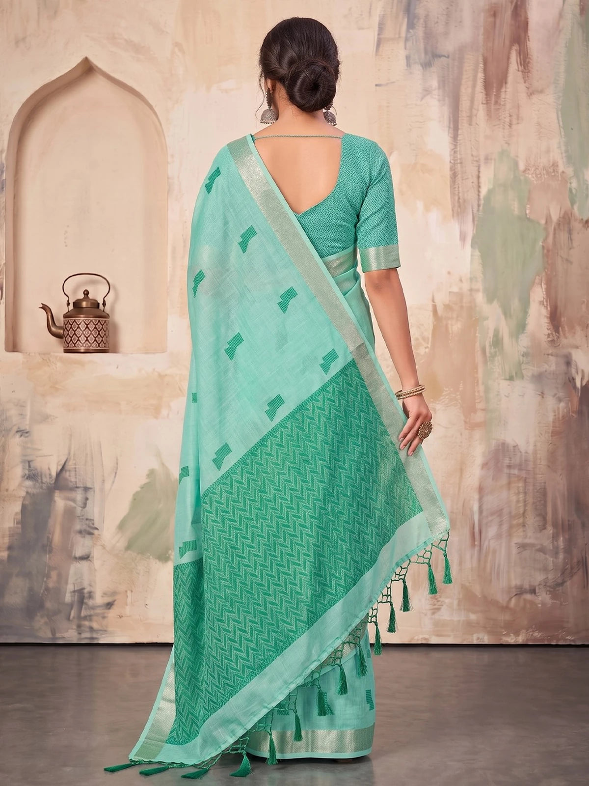 Tarani mint green linen cotton saree back view showing woven pallu tassels and blouse design
