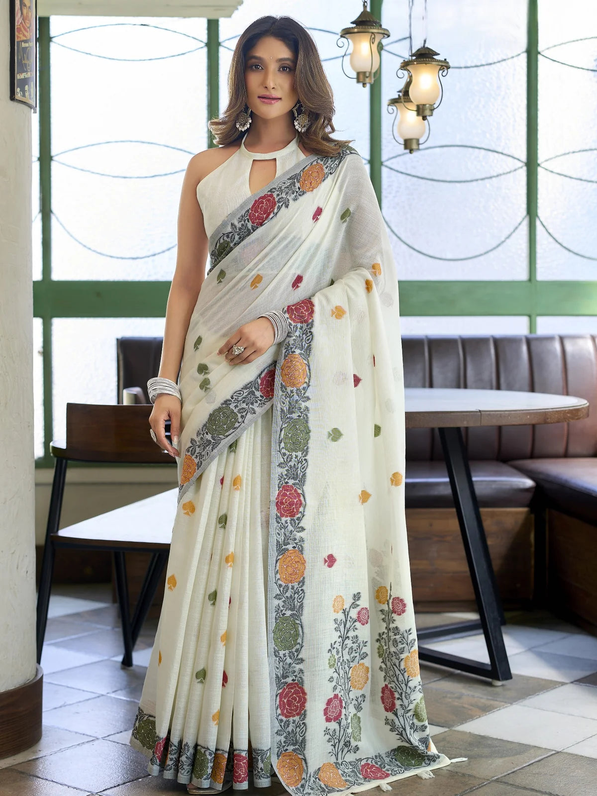 Tarani off white linen handloom saree with floral woven border full saree festive look
