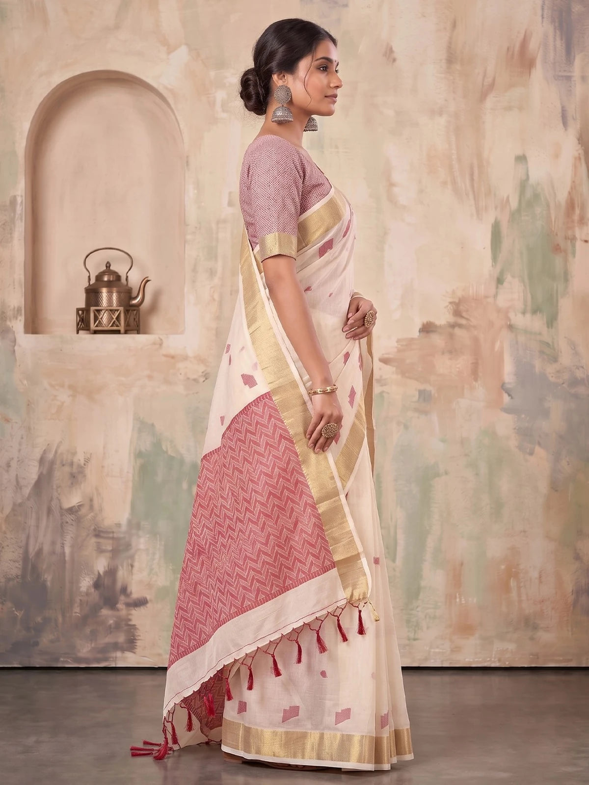 Tarani off white linen cotton saree with geometric woven work and tassels side view