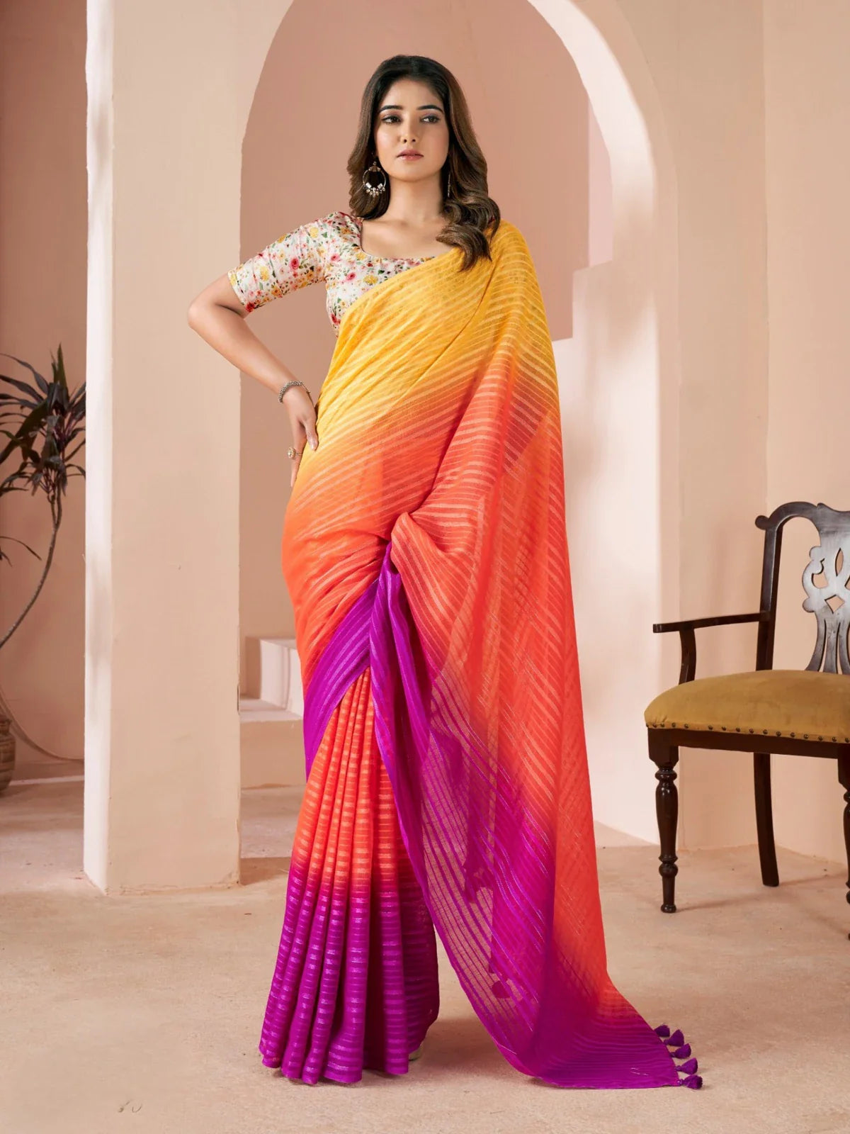 Tarani linen orange festive saree with floral blouse and elegant drape