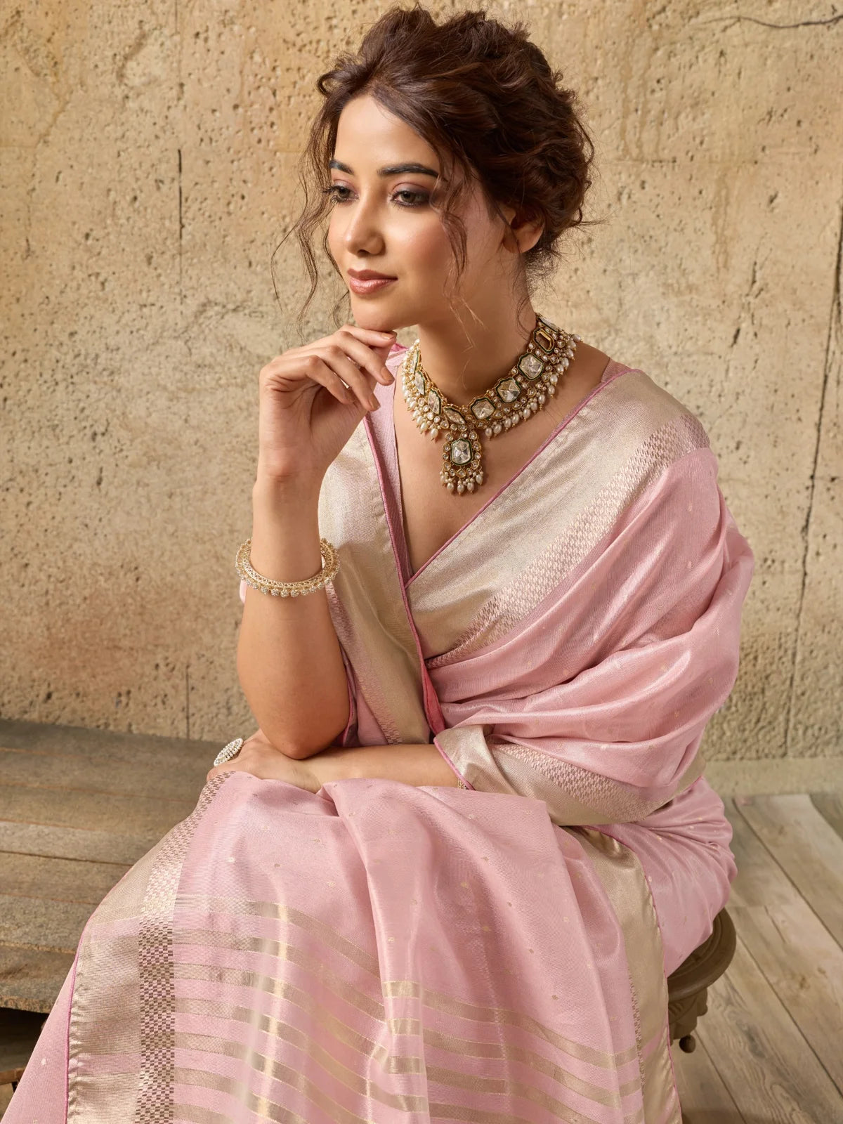 Tarani pink Tissue Linen saree closeup view featuring zari motifs and premium woven texture