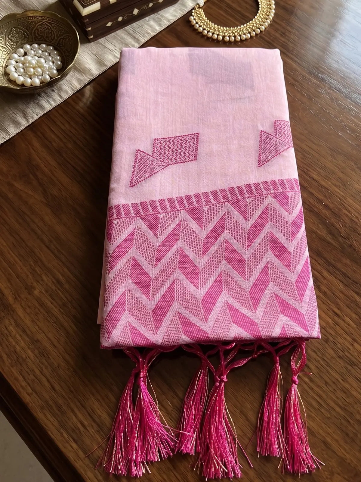 Tarani folded light pink linen cotton saree with woven pallu and tassels