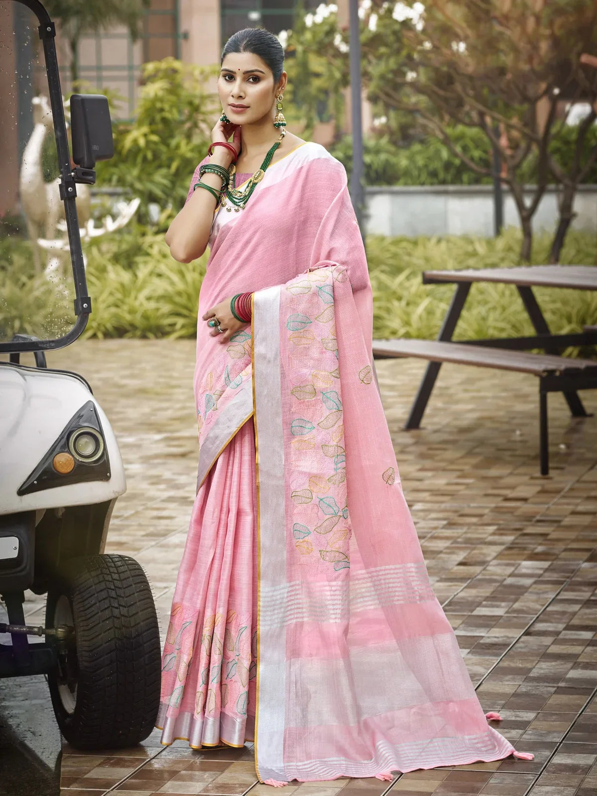 Tarani pink linen saree full view with delicate motifs and matching blouse piece
