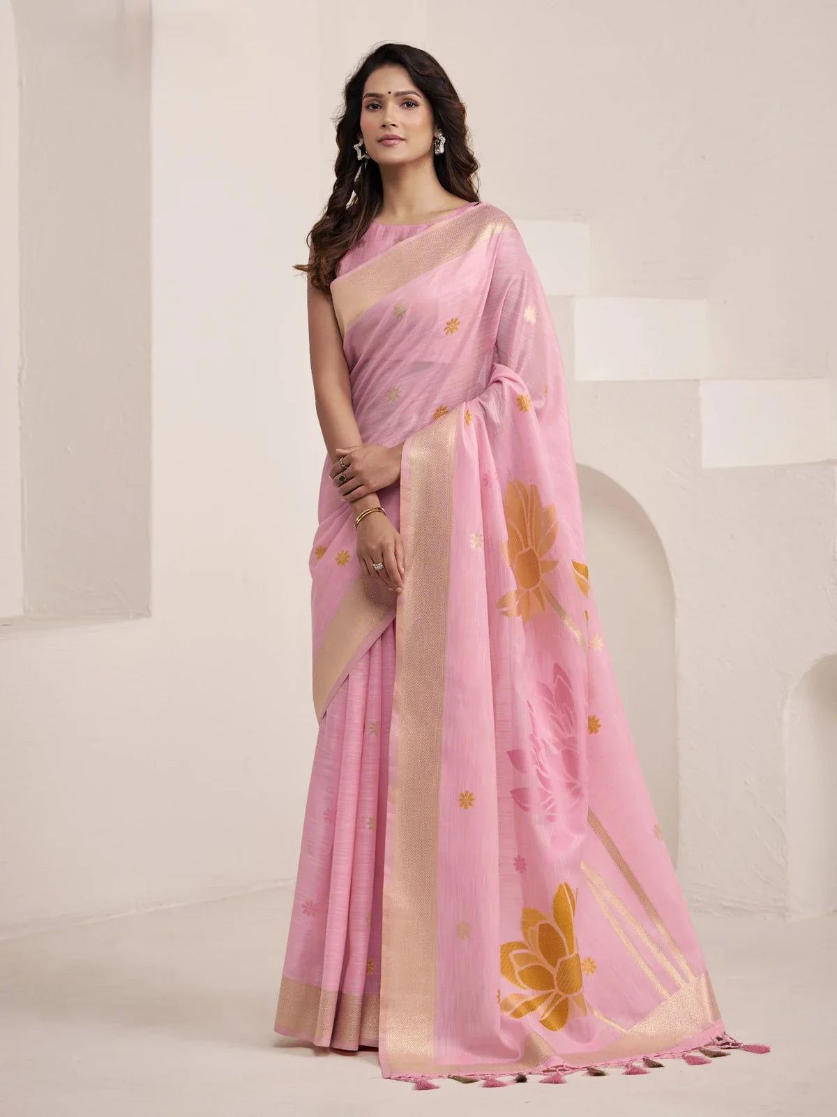 Tarani premium pink linen saree with golden lotus motifs and elegant pallu for festive occasions