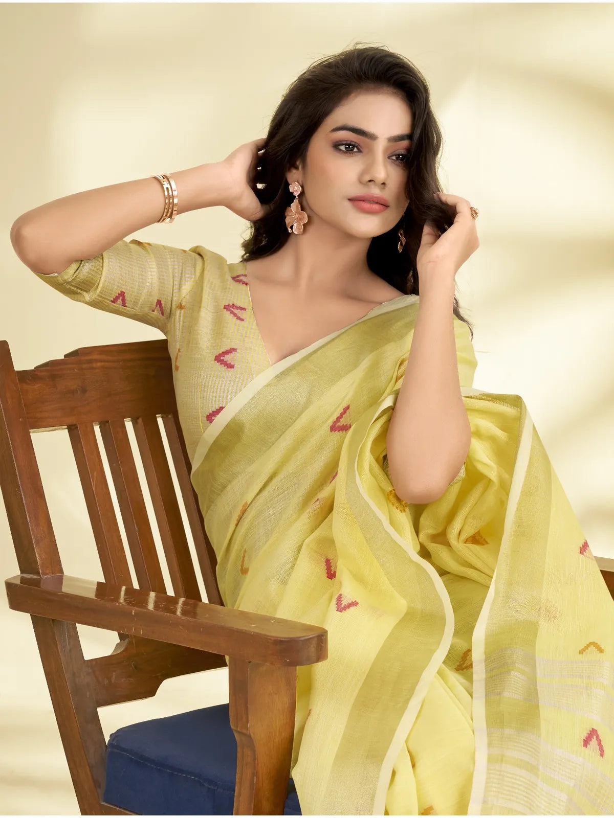 Tarani linen silk saree in yellow with zari weave and minimal motifs front standing view