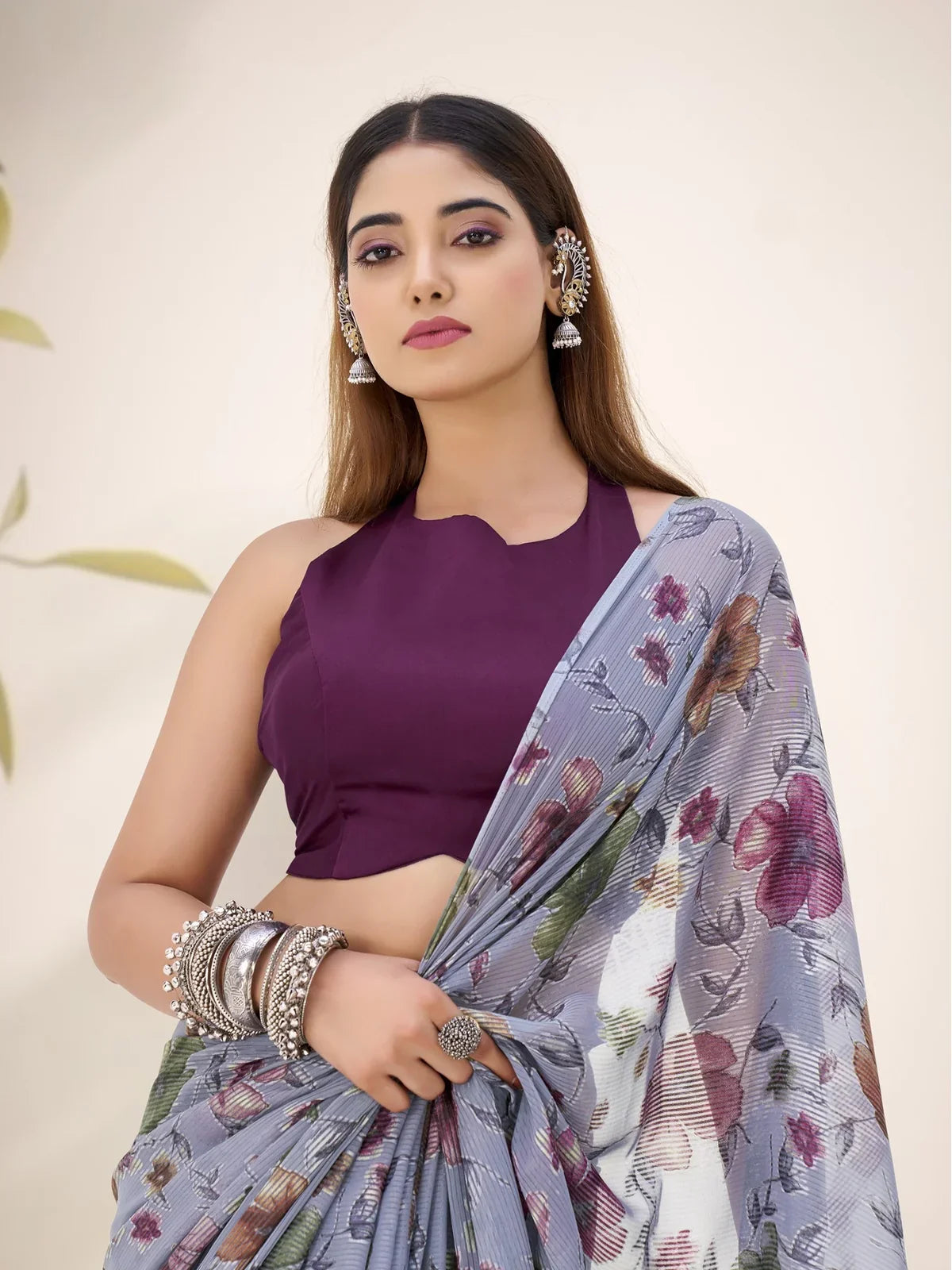 Tarani party wear Lurex Brasso saree upper body close-up with soft floral patterns