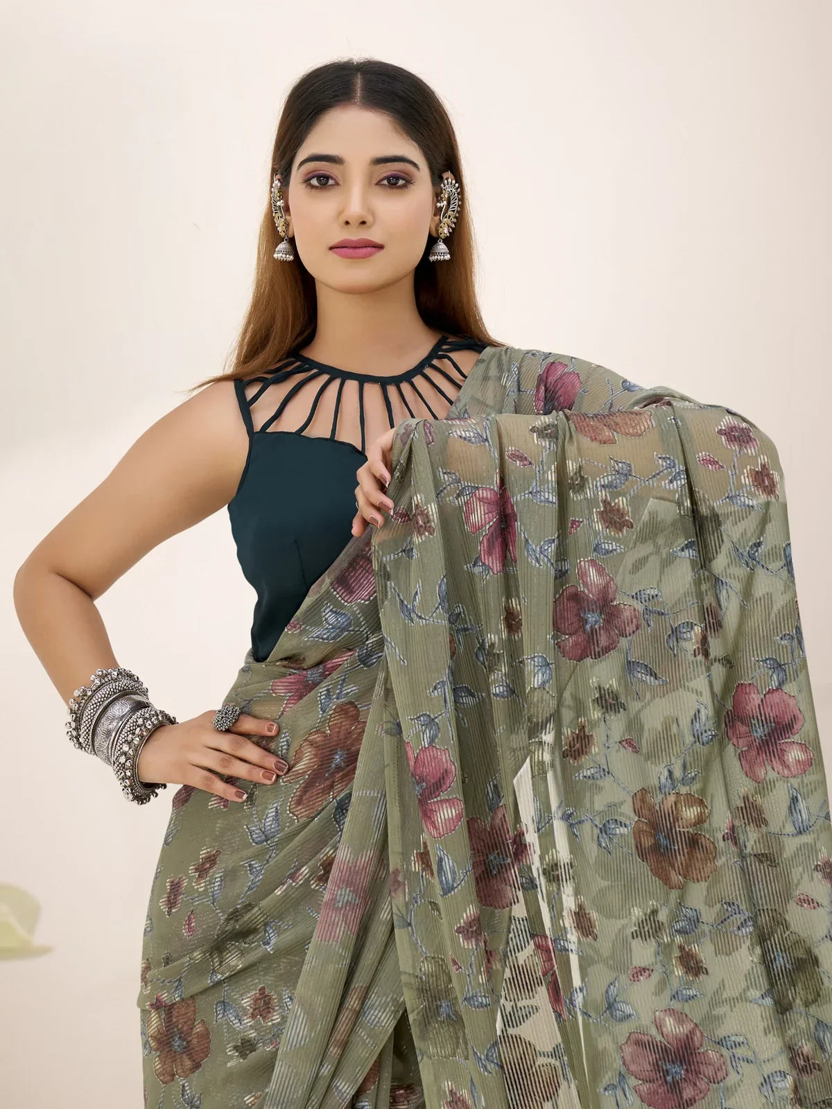 Tarani upper body view of model wearing green lurex brasso saree styled for festive or casual events