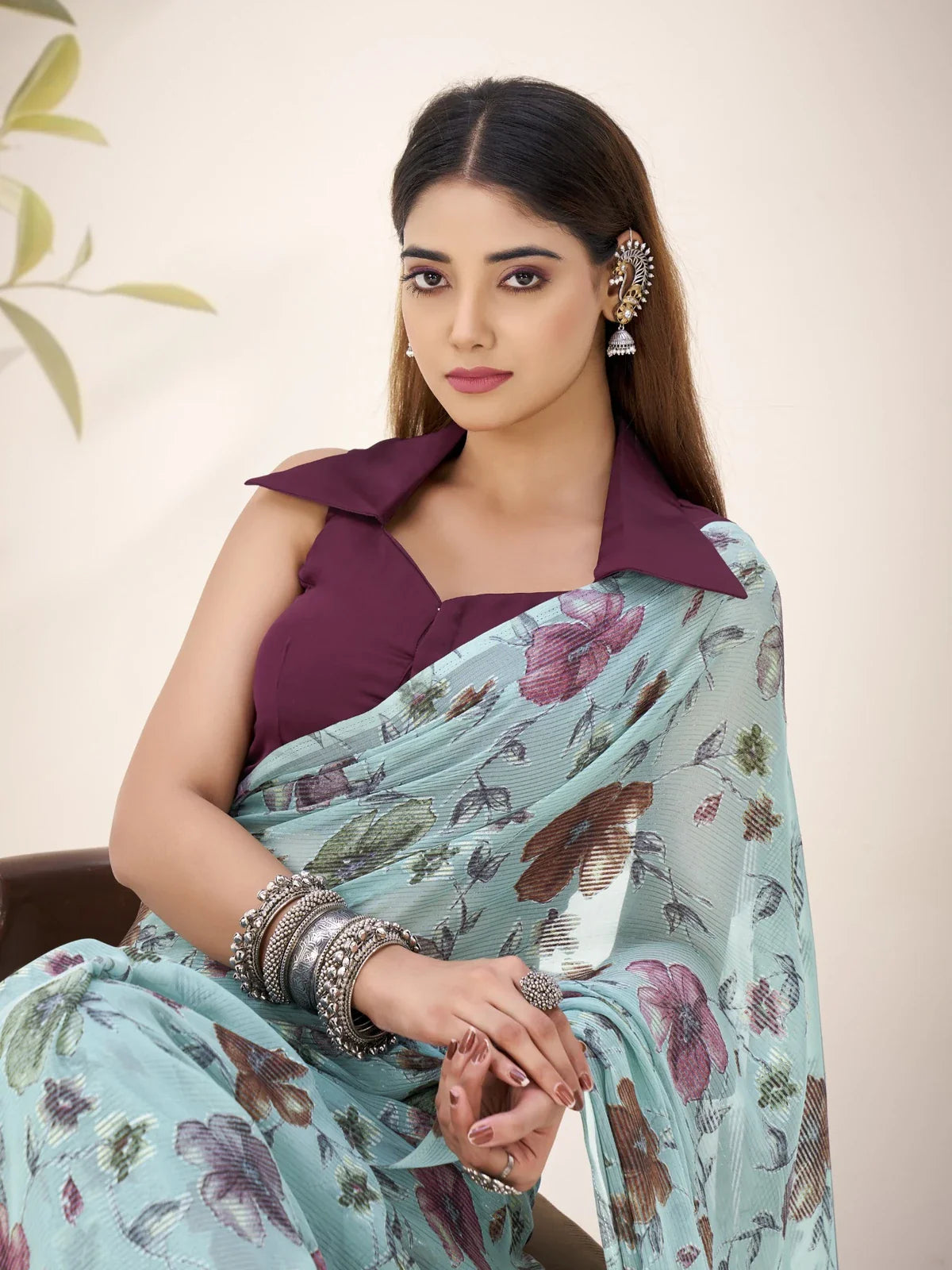 Tarani premium party saree in light blue floral print with deep wine blouse closeup