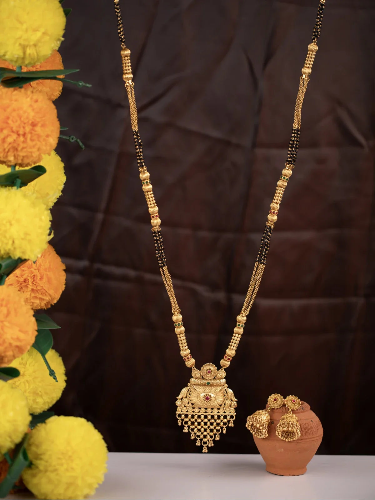 Tarani gold plated mangalsutra full view with temple inspired pendant and matching earrings