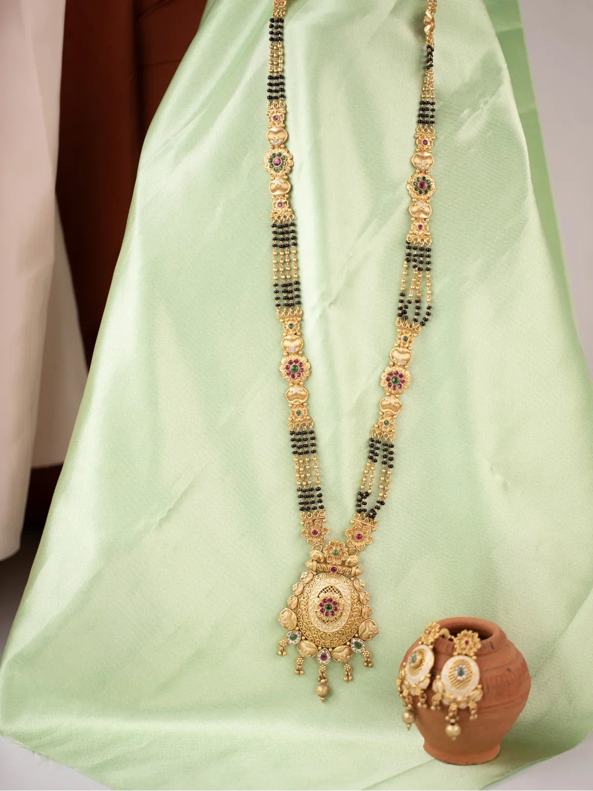 Tarani gold plated mangalsutra full view with stone studded design and matching earrings