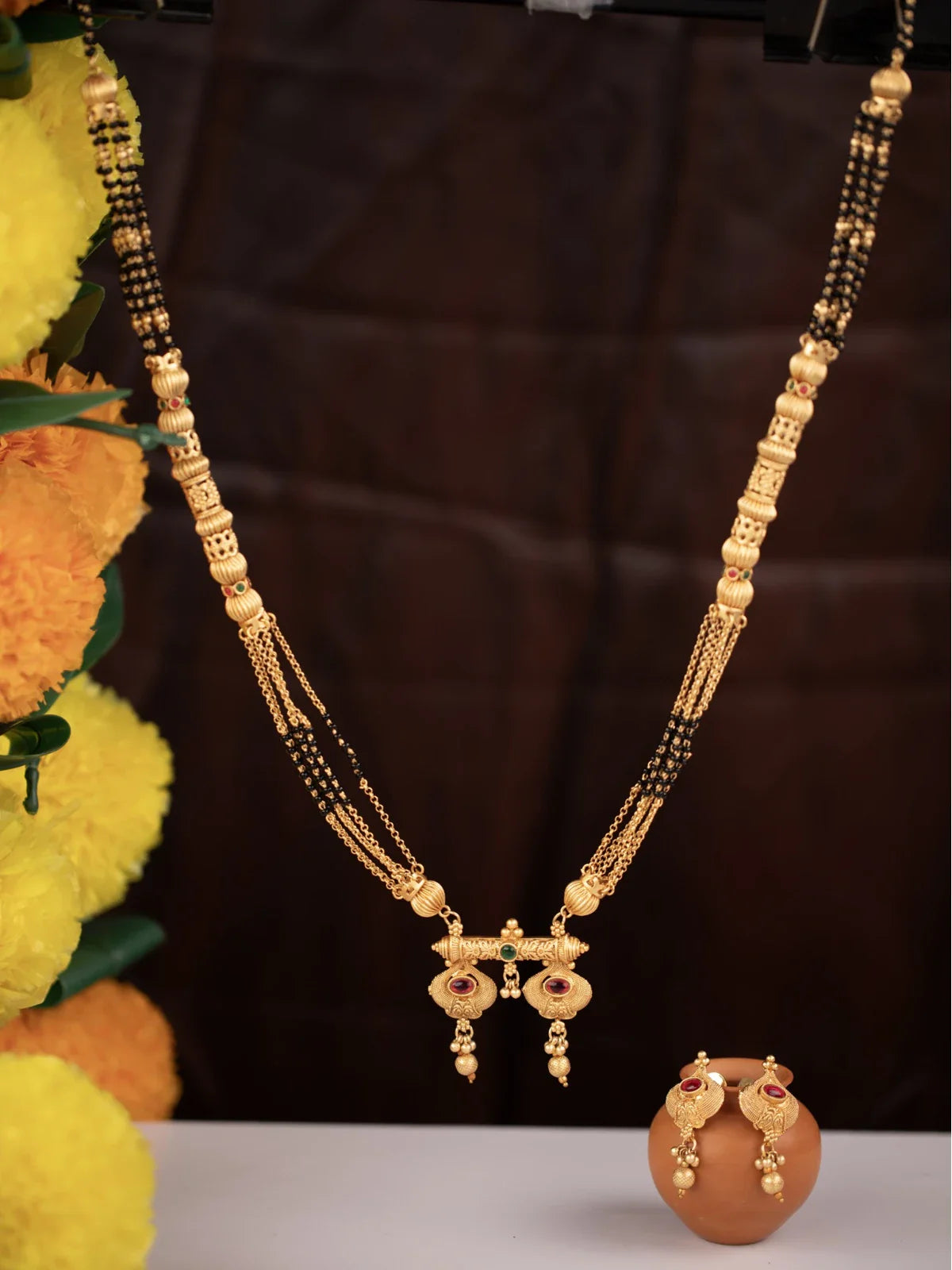 Tarani gold plated mangalsutra with traditional design and matching earrings for weddings