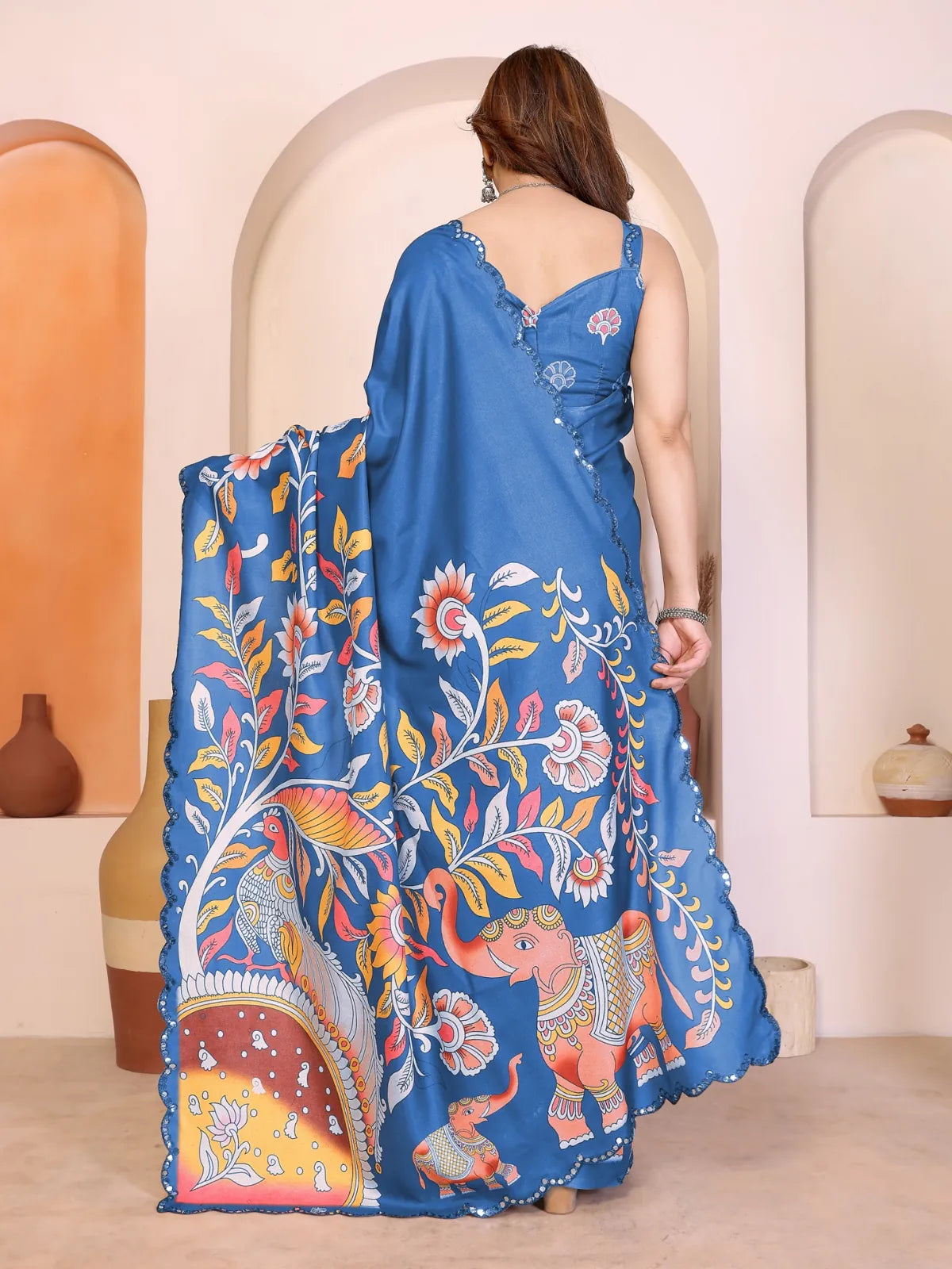 Back view of Tarani Manipuri saree showing elephant motifs and mirror border detailing