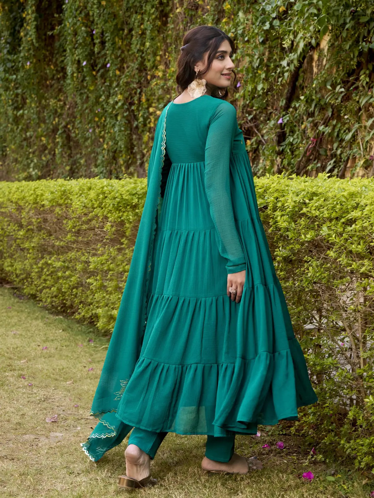 Tarani back view of elegant green marbel festive dress with full-length sleeves and flare