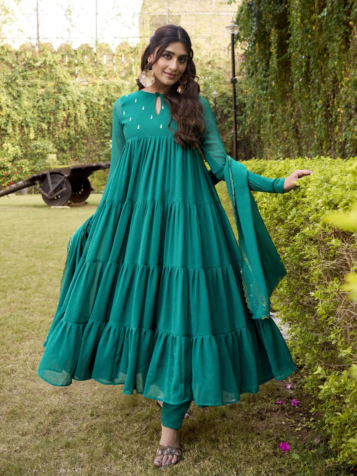 Tarani full view of green layered marbel anarkali dress with matching pants and dupatta
