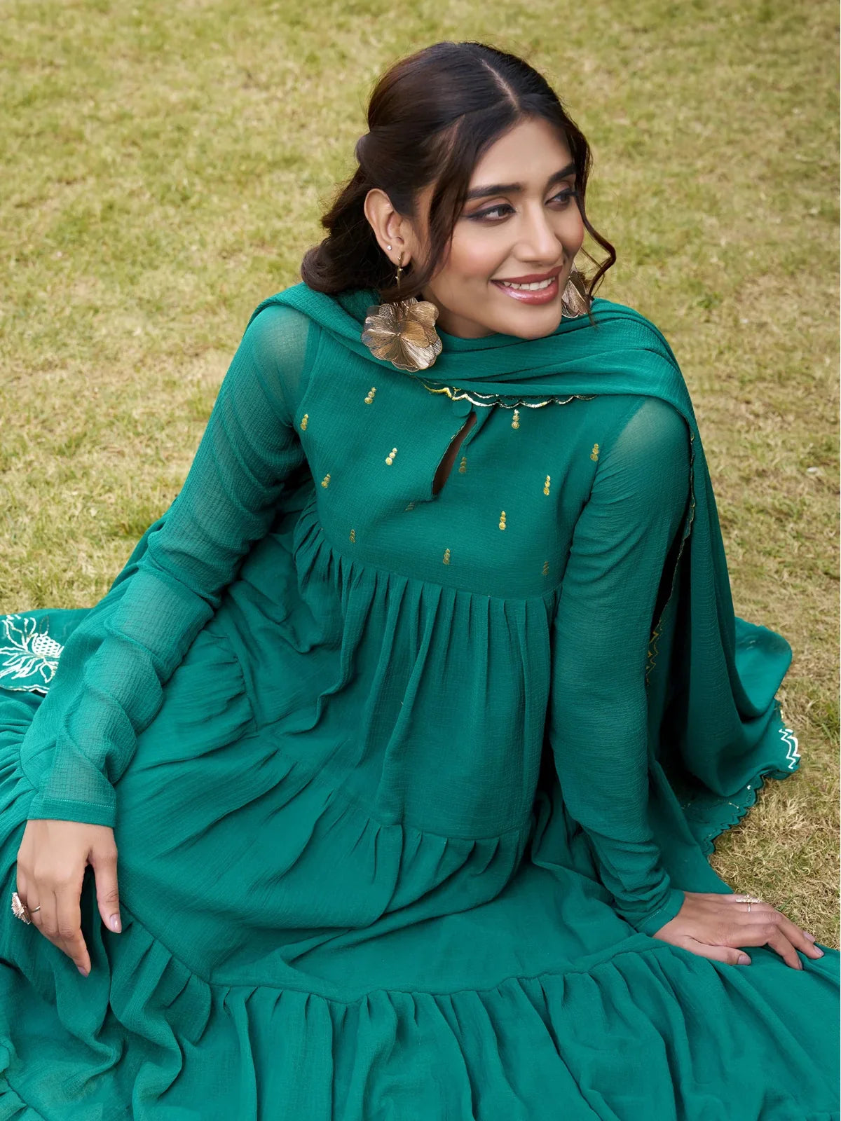 Tarani upper body view showing foil work detail and neckline of green marbel anarkali dress