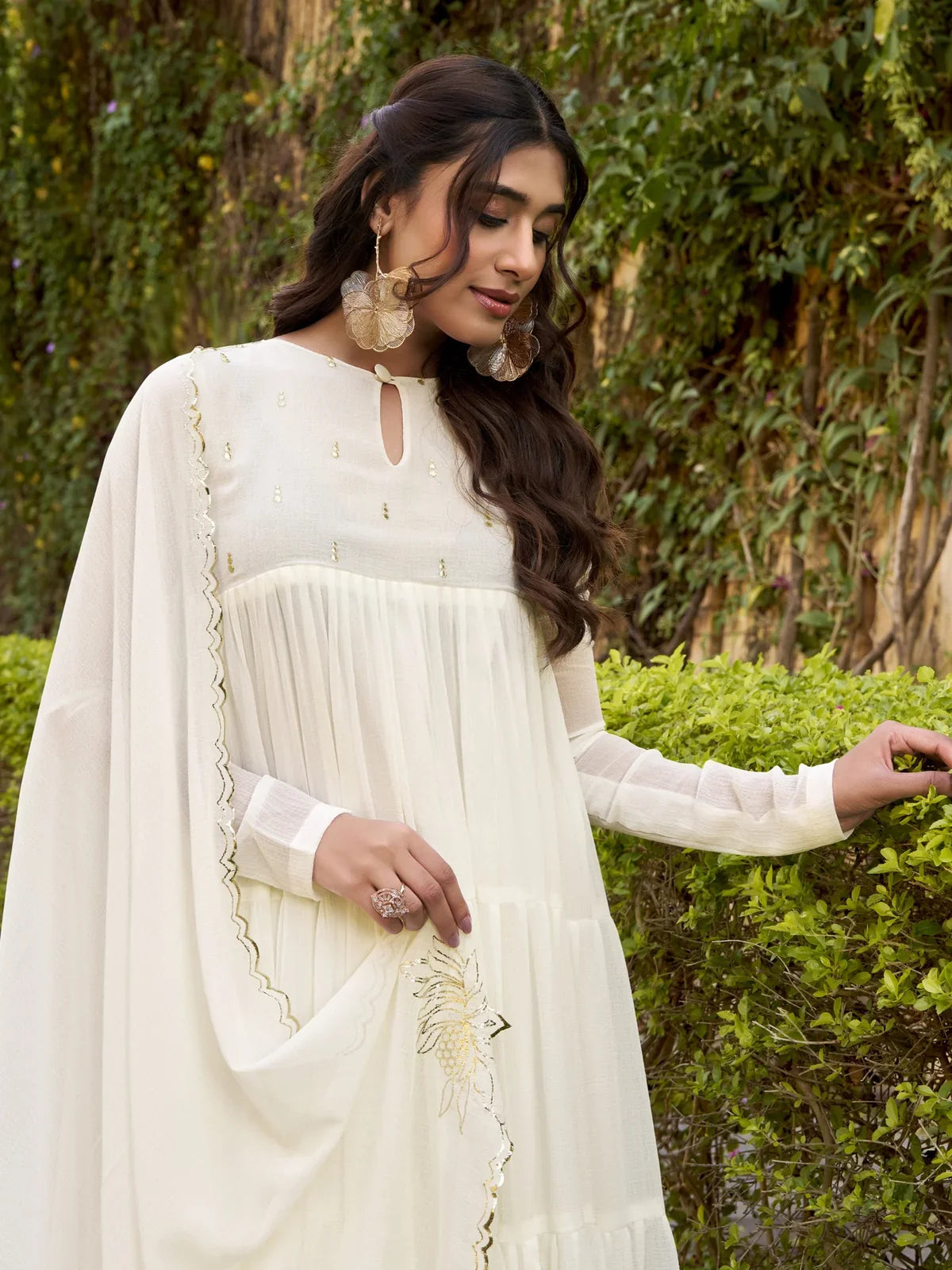 Tarani off white festive Anarkali dress closeup showing foil work embroidery and neckline