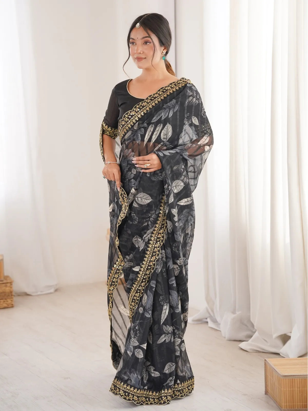 Tarani black marble chiffon saree with floral leaf print and golden embroidered blouse front full view