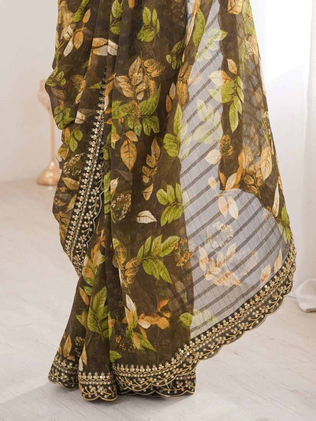 Tarani closeup of green leaf print marble saree fabric and sequin detailing