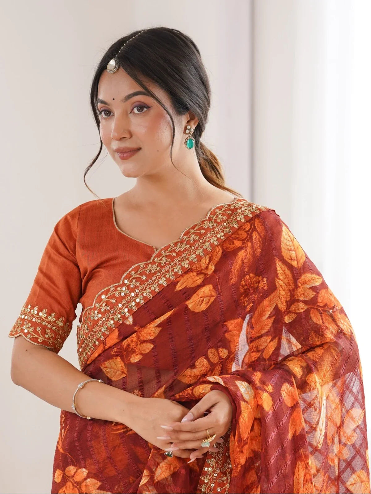 Tarani festive maroon floral saree upper body view with detailed blouse and soft drape