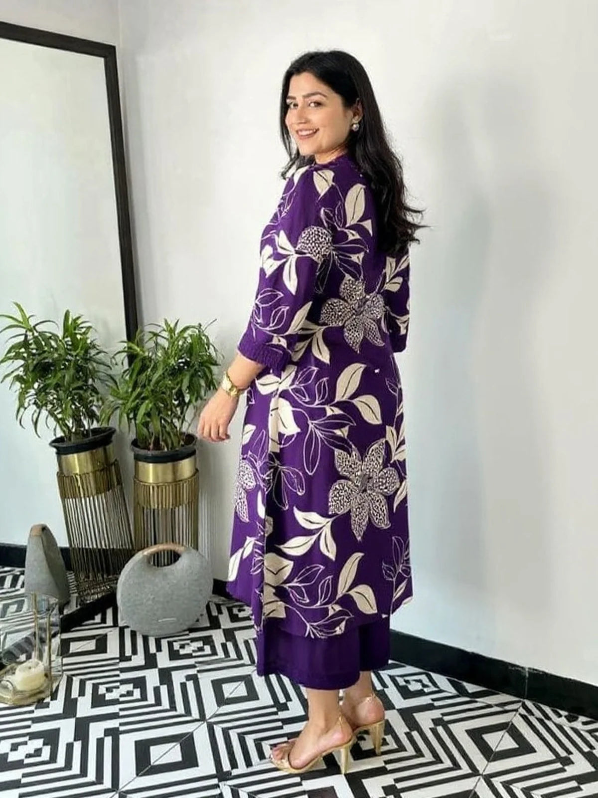 Tarani back view of purple maslin kurti dress showing elegant floral prints and styling