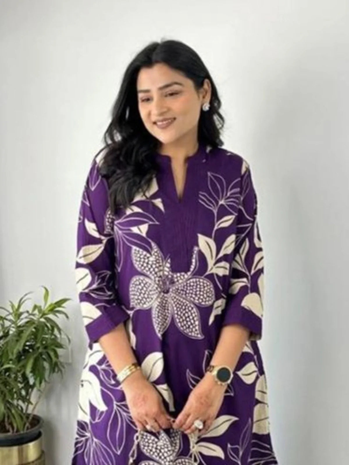 Tarani purple maslin kurti upper half closeup with printed floral neckline and quarter sleeves