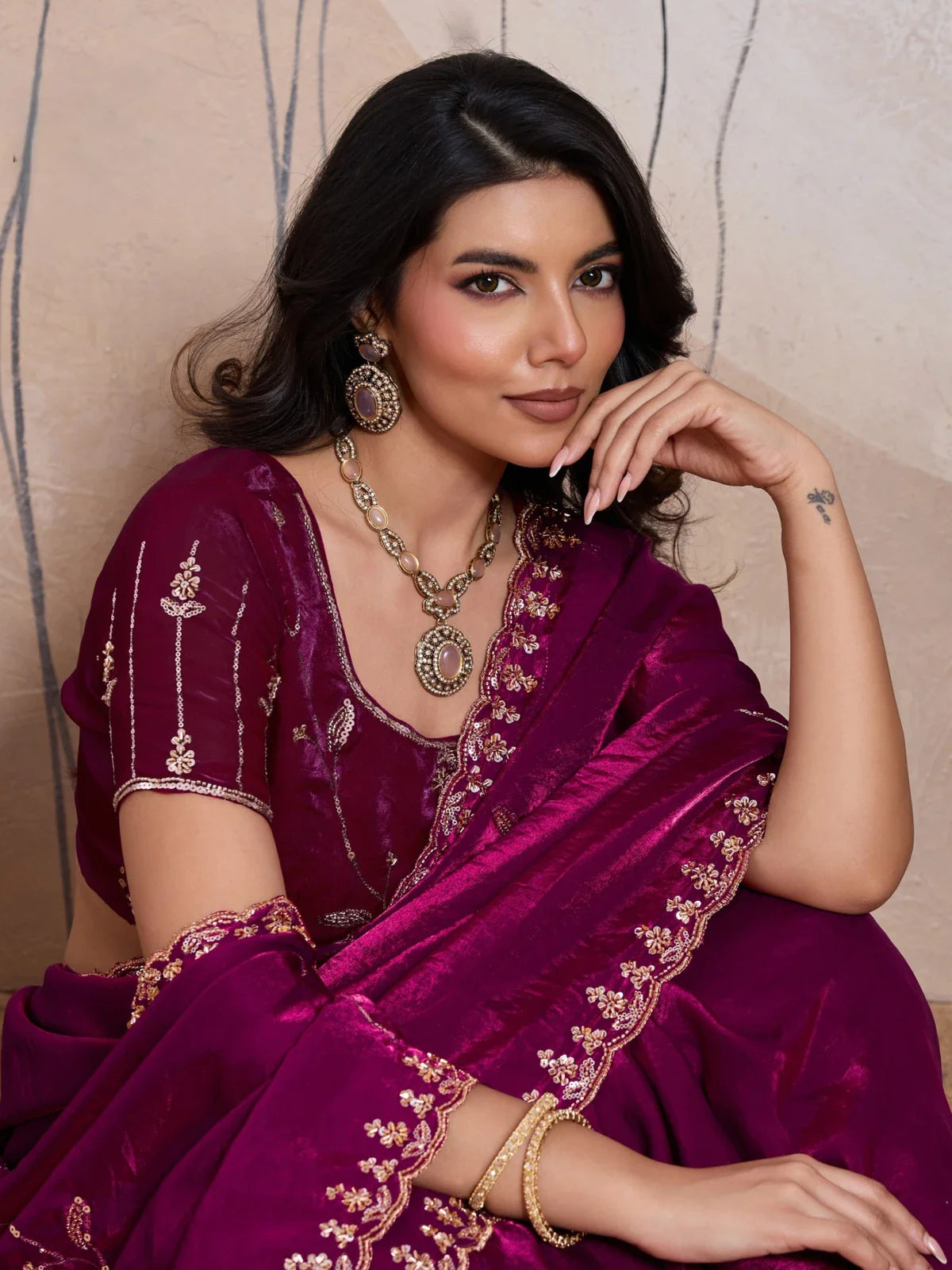 Tarani upper body view of magenta saree with blouse and festive jewellery