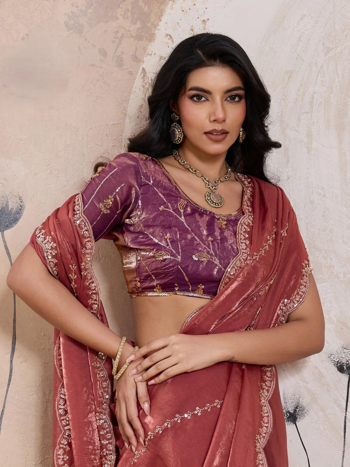 Tarani metallic velvet satin maroon saree upper body view with embroidered blouse in purple tone