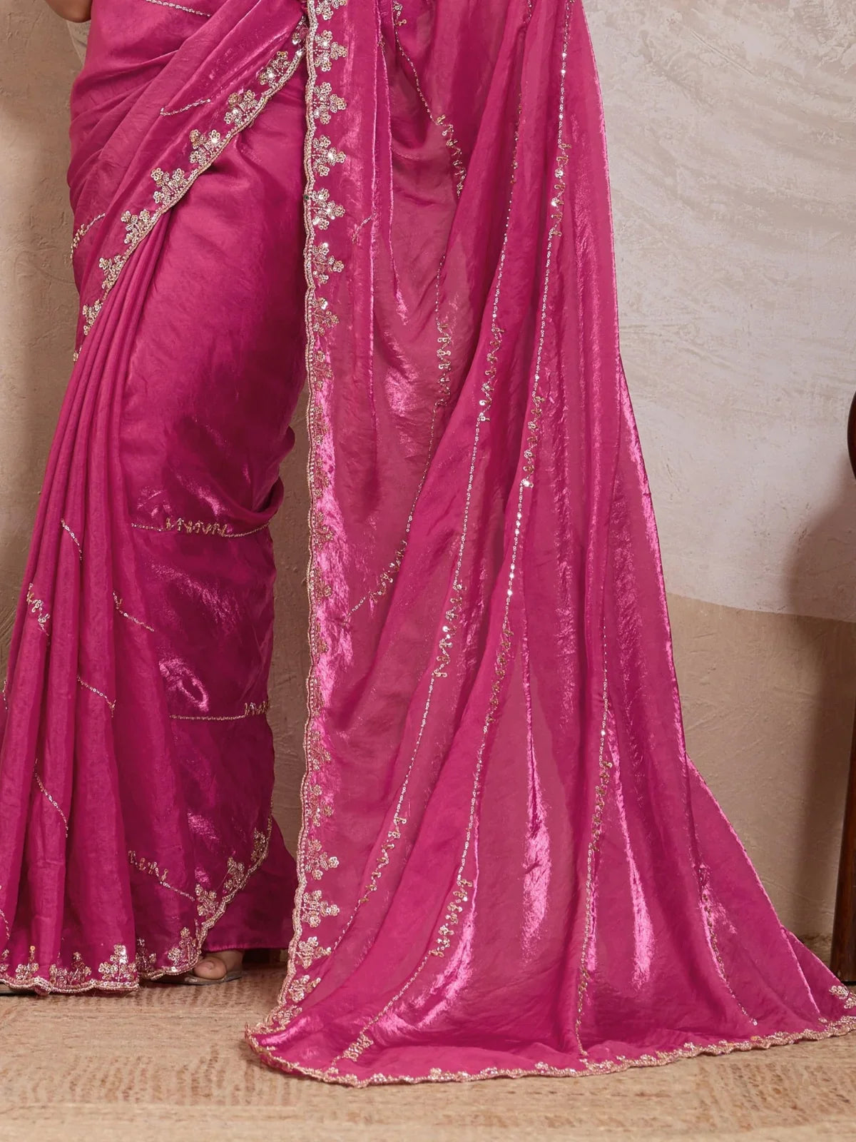 Tarani pallu close-up showing heavy zari work with cutdana and floral detailing in pink metallic velvet satin fabric