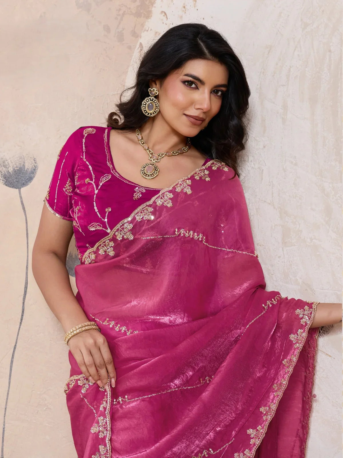 Tarani upper body view of pink saree with metallic shine and embroidered blouse in beads and sequins