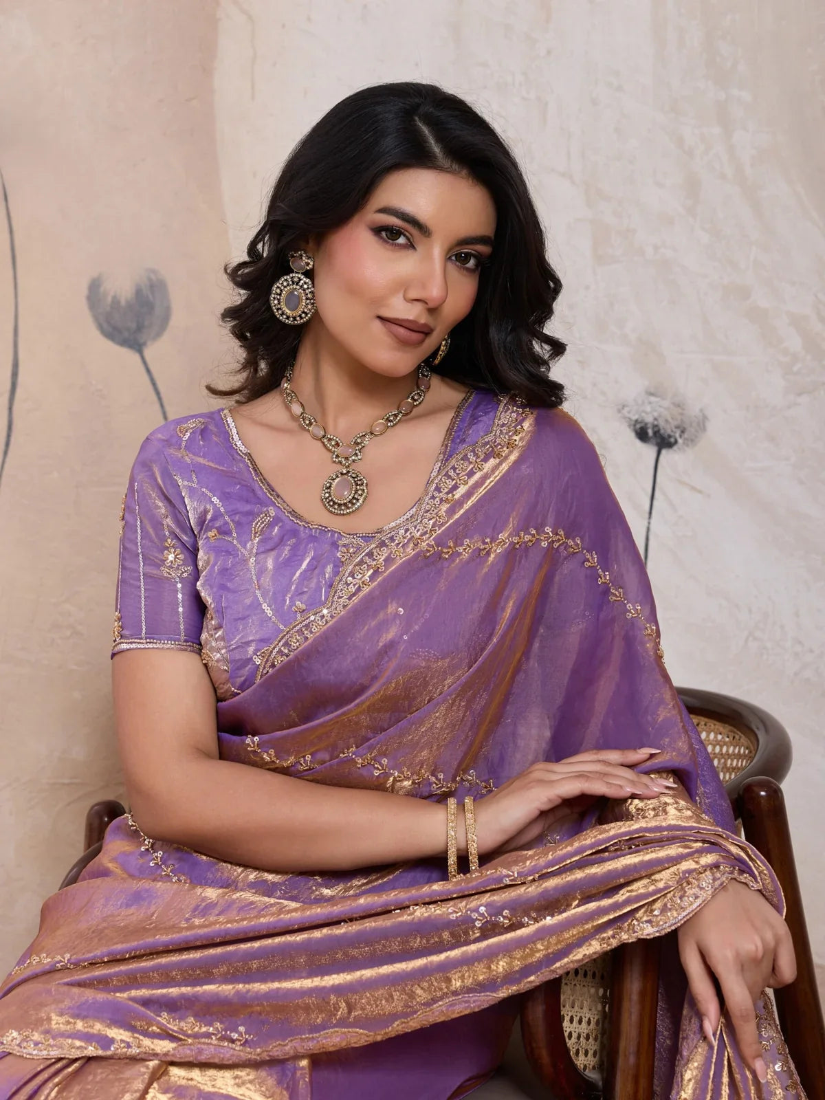 Tarani festive purple saree with golden pallu and metallic blouse close-up side pose