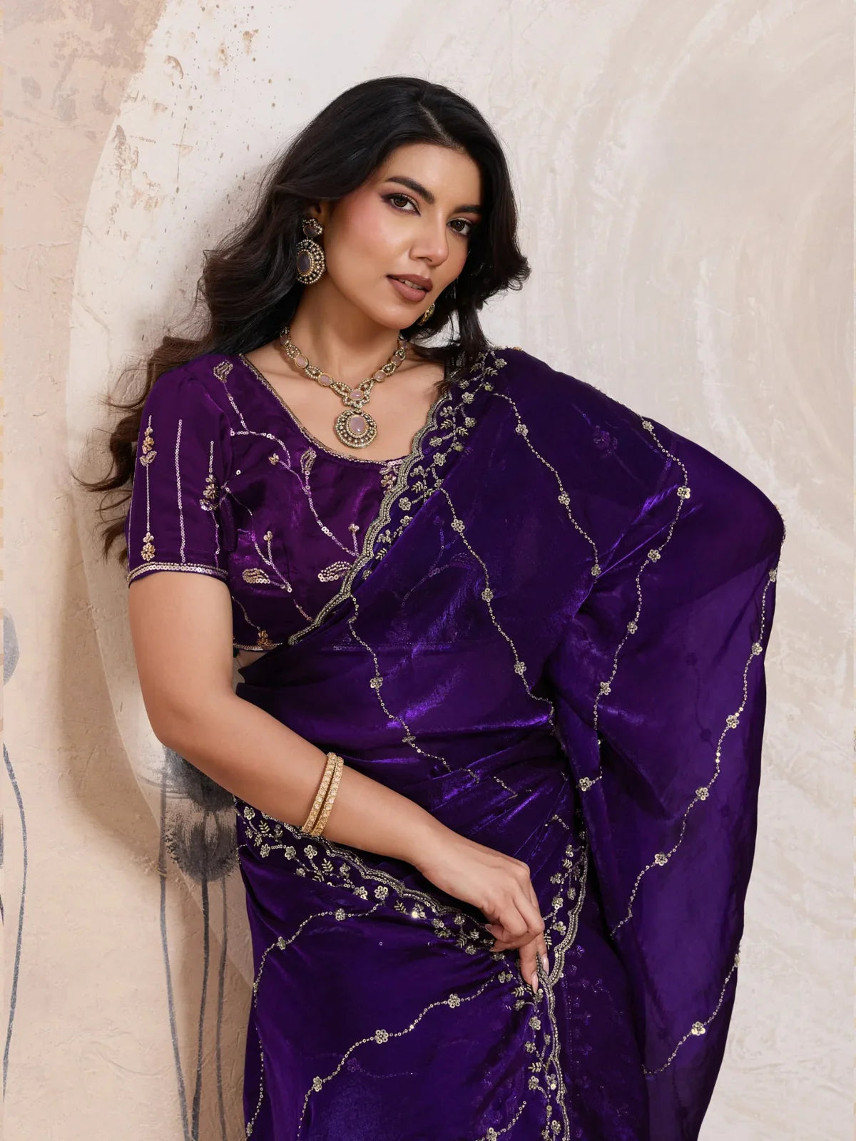 Tarani upper body view of purple velvet satin saree with cutdana and zari embroidery
