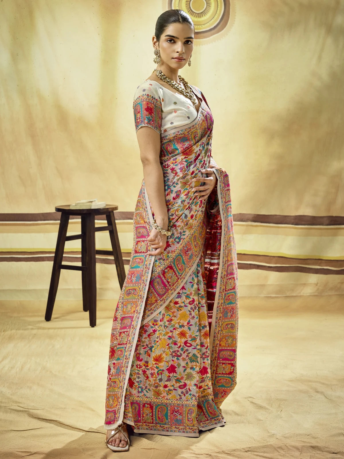 Tarani Harshika beige modal cotton pashmina saree side view with floral drape and border