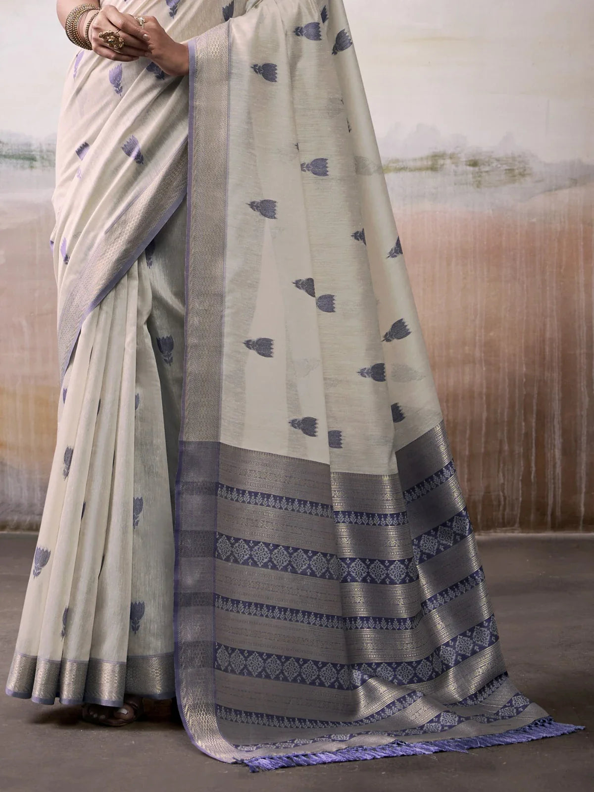 Tarani beige modal cotton saree pallu view highlighting woven zari design