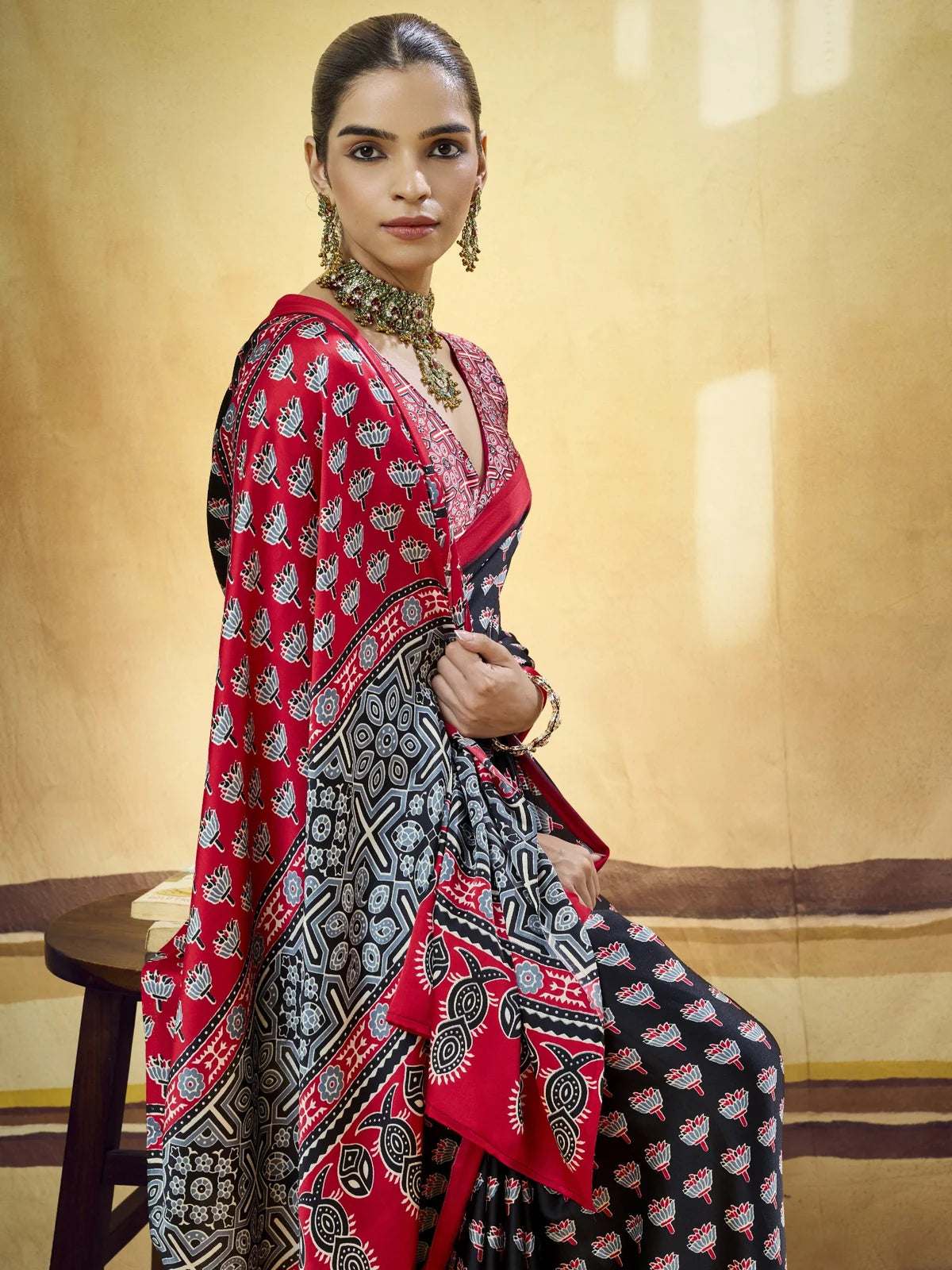 Tarani black Modal Satin Ajrakh Print saree upper body view showing blouse and border