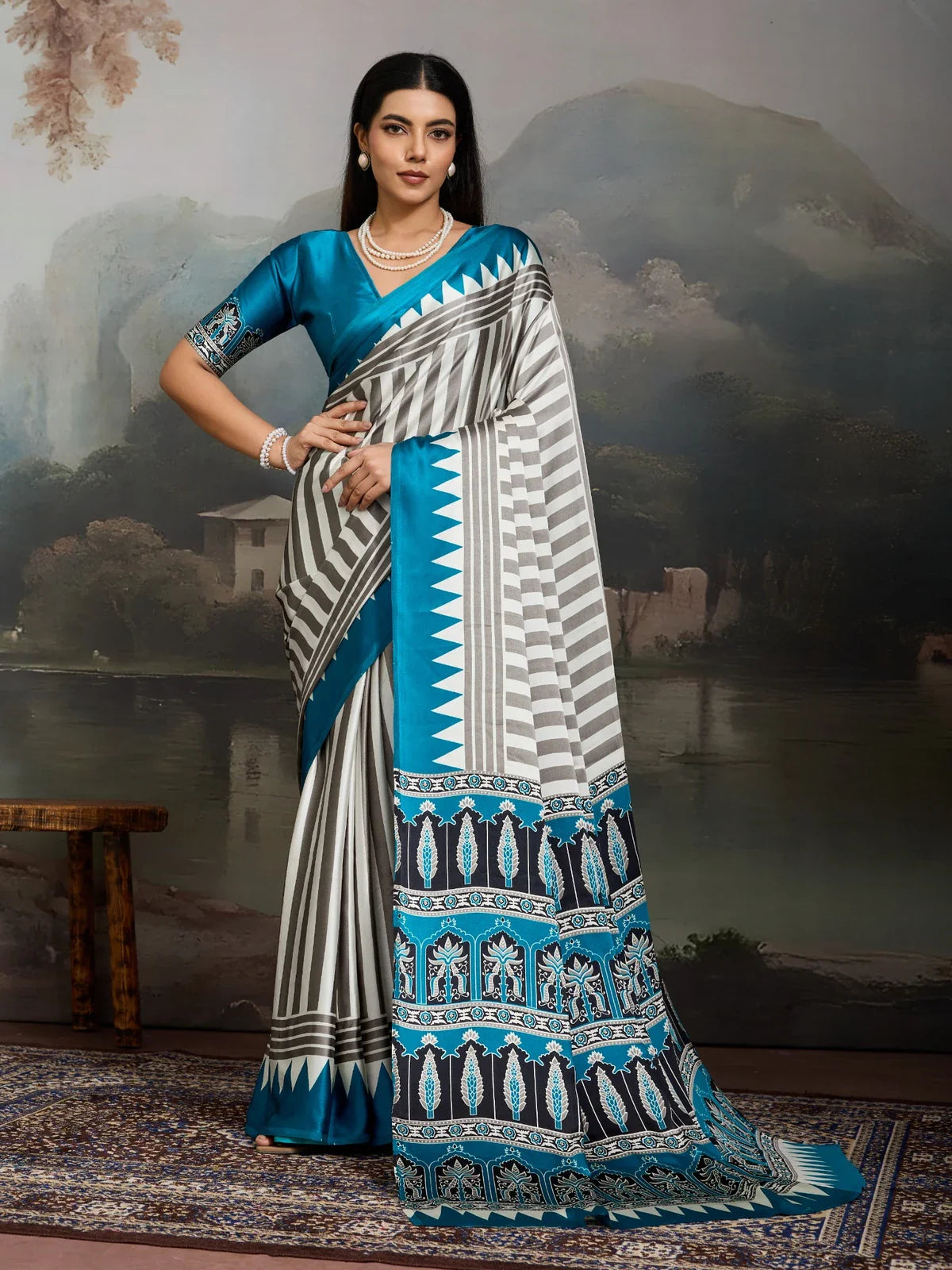 Tarani elegant blue modal satin ajrakh print saree in full view with graceful drape