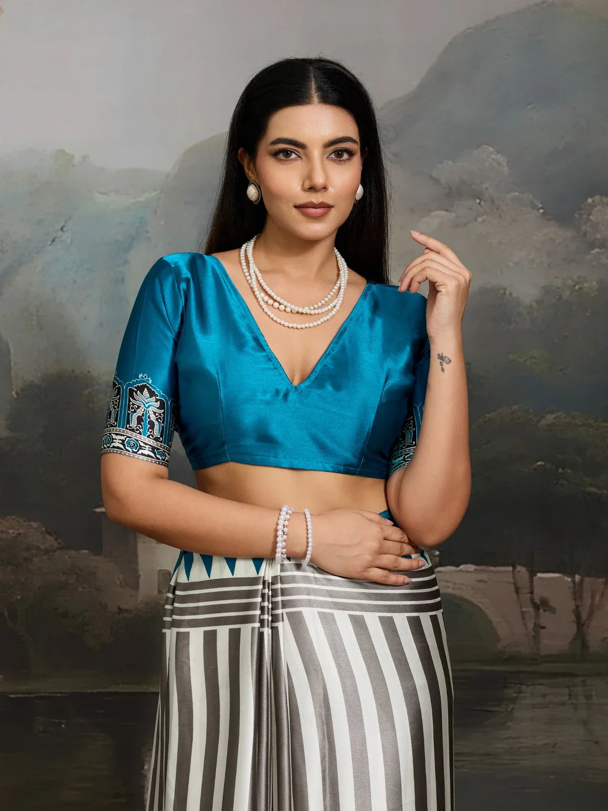 Tarani blue ajrakh print saree close-up showing upper body and designer blouse details