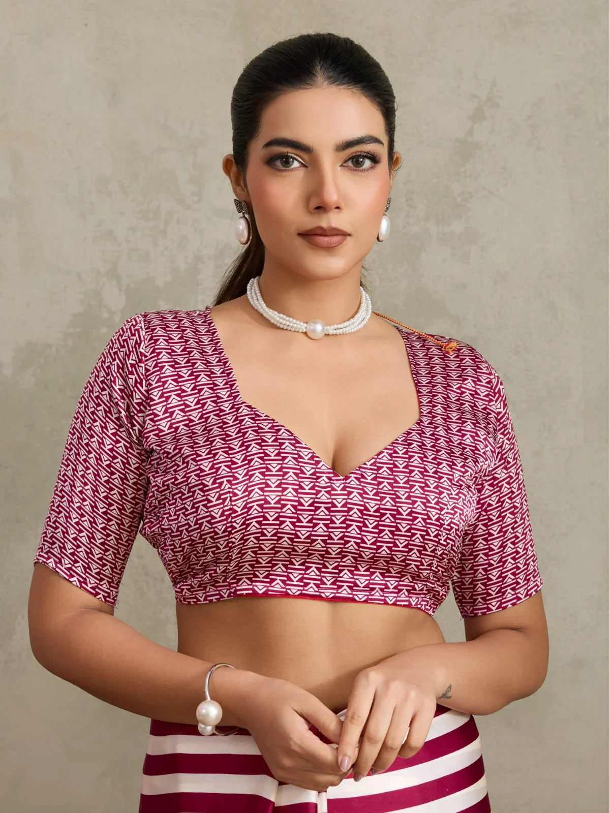 Tarani Modal Satin maroon saree upper body view with printed blouse and pearl jewellery