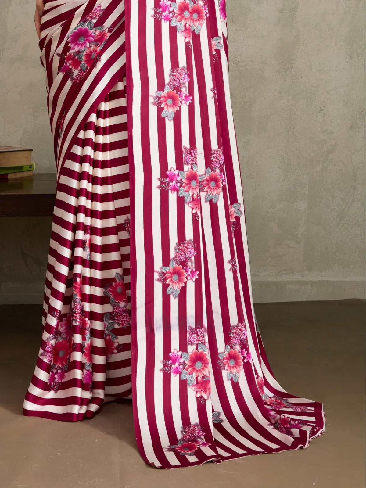 Tarani Modal Satin maroon saree fabric closeup showing floral stripe pattern